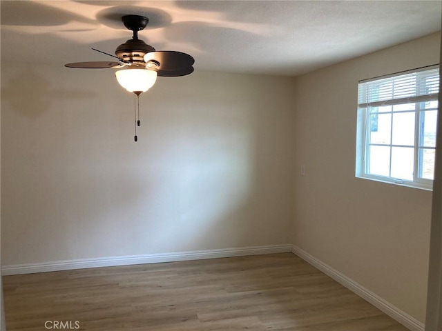 21483 Main St, Barstow, CA 92311 - unfurnished room with ceiling fan and light wood-type flooring