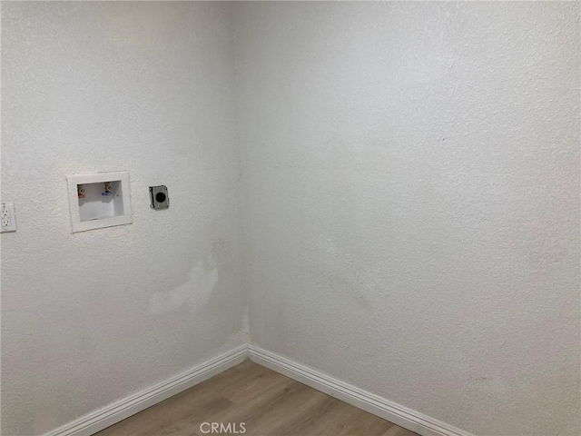 21483 Main St, Barstow, CA 92311 - laundry room with electric dryer hookup, washer hookup, and hardwood / wood-style flooring