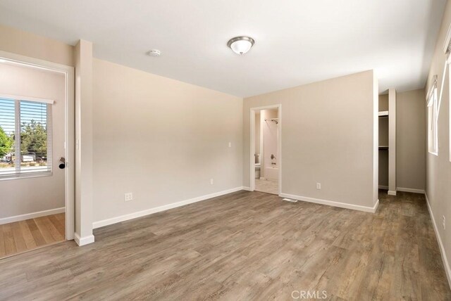 empty room featuring hardwood / wood-style flooring