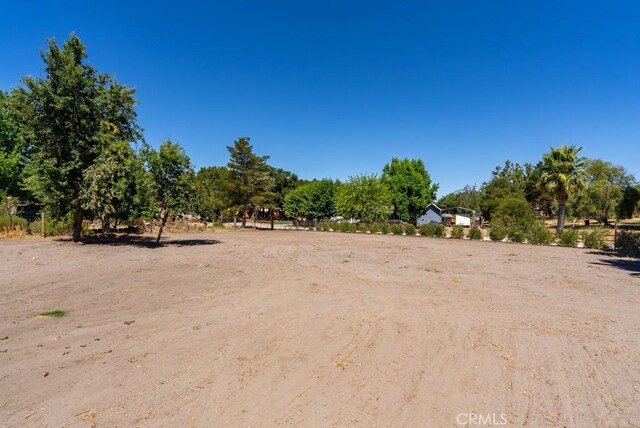 view of yard with a rural view