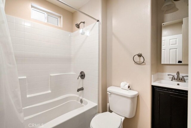 full bathroom with shower / bathtub combination with curtain, vanity, and toilet