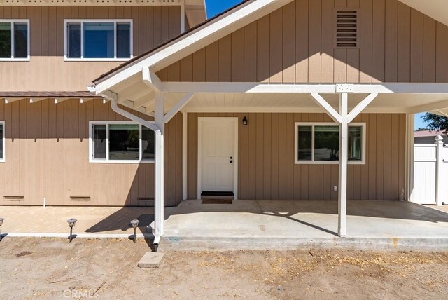 property entrance with a patio area