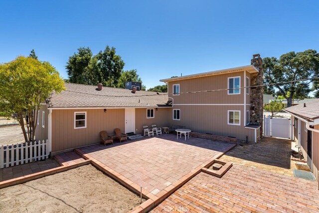 rear view of house featuring a patio area