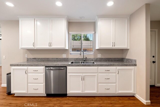 kitchen with sink, white cabinets, and dishwasher