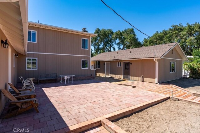 back of property featuring a patio