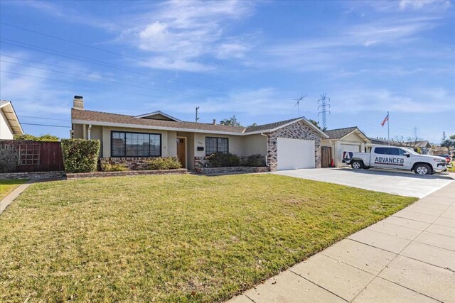 ranch-style house featuring a garage and a front lawn