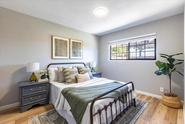 bedroom with light hardwood / wood-style floors