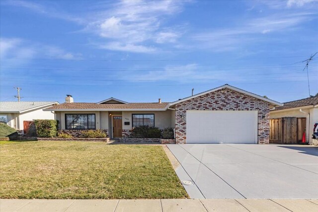 ranch-style home featuring a garage and a front yard