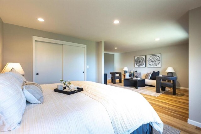 bedroom featuring light hardwood / wood-style floors and a closet