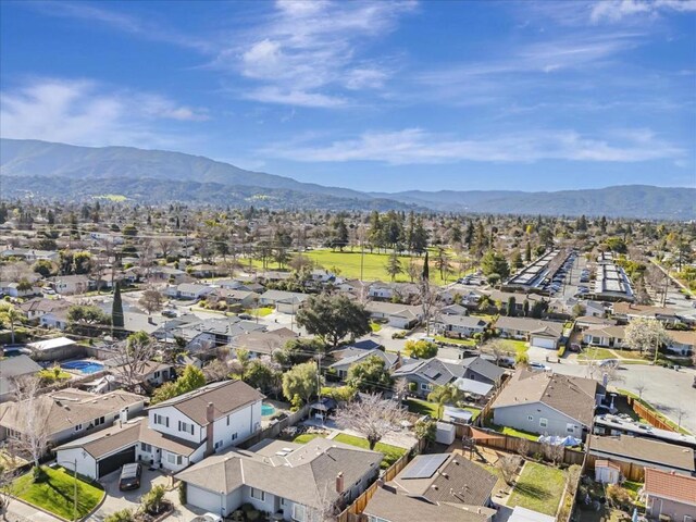 birds eye view of property featuring a mountain view