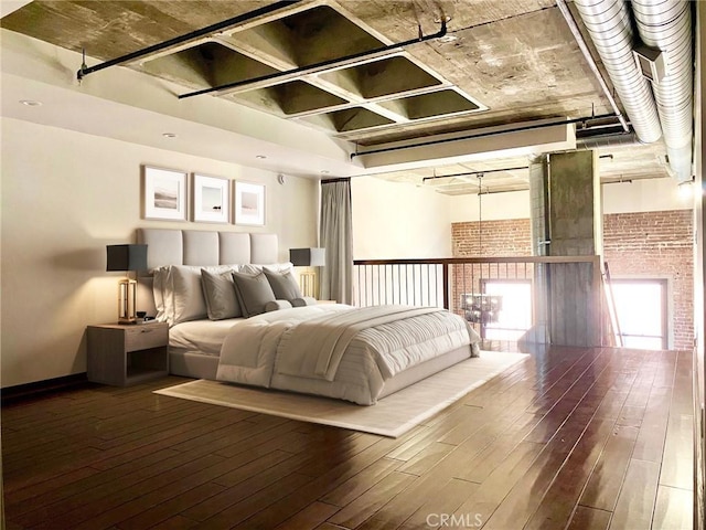 bedroom with hardwood / wood-style flooring