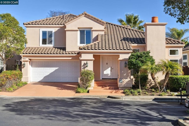 mediterranean / spanish-style home featuring a garage