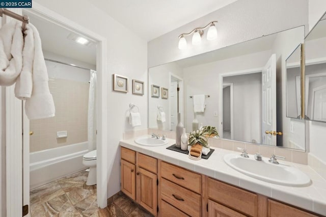 full bathroom featuring vanity, shower / bathtub combination with curtain, and toilet