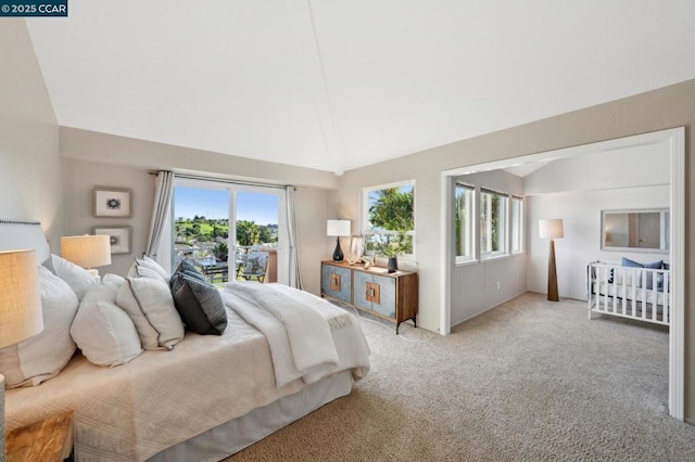 bedroom with multiple windows, light carpet, high vaulted ceiling, and access to outside