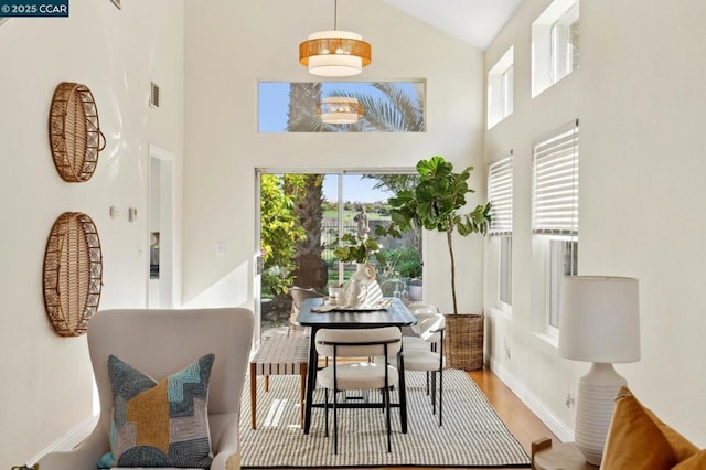 sunroom featuring lofted ceiling