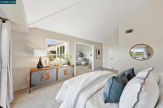 bedroom featuring carpet and high vaulted ceiling