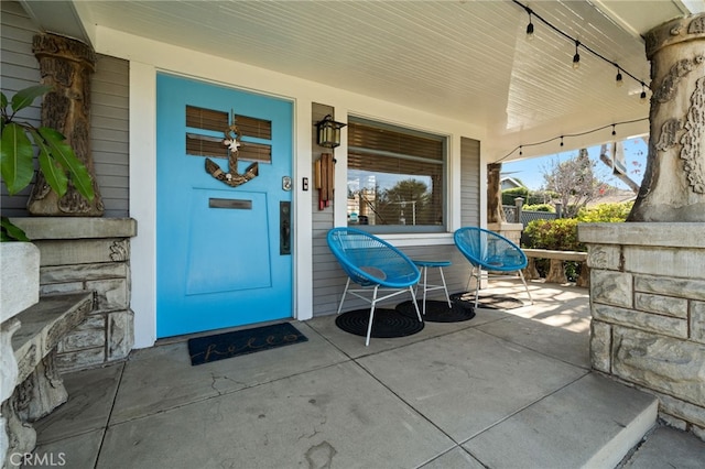 doorway to property with covered porch