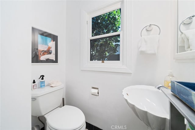 bathroom with toilet and sink