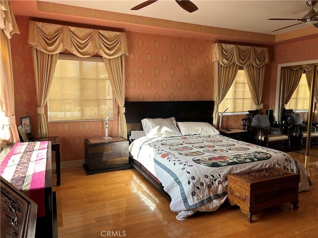 bedroom featuring light wood-type flooring and ceiling fan