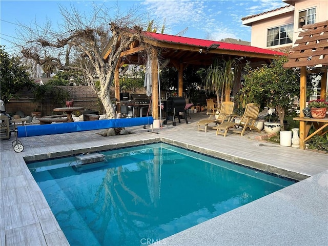 view of swimming pool featuring a grill