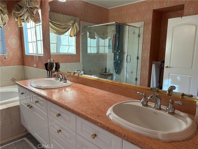 bathroom with vanity and independent shower and bath