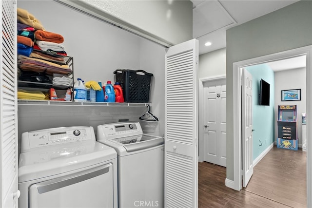 washroom with hardwood / wood-style floors and independent washer and dryer