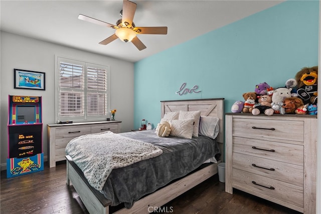 bedroom featuring dark hardwood / wood-style flooring and ceiling fan