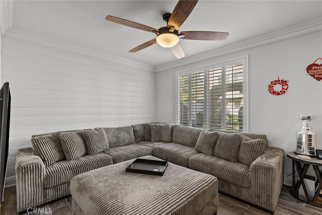 living room featuring ceiling fan, ornamental molding, and dark hardwood / wood-style flooring