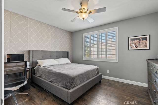 bedroom with dark hardwood / wood-style flooring and ceiling fan