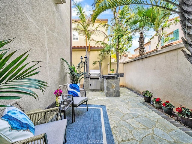 view of patio featuring area for grilling and grilling area