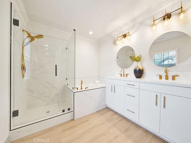 bathroom featuring crown molding, vanity, shower with separate bathtub, and hardwood / wood-style flooring