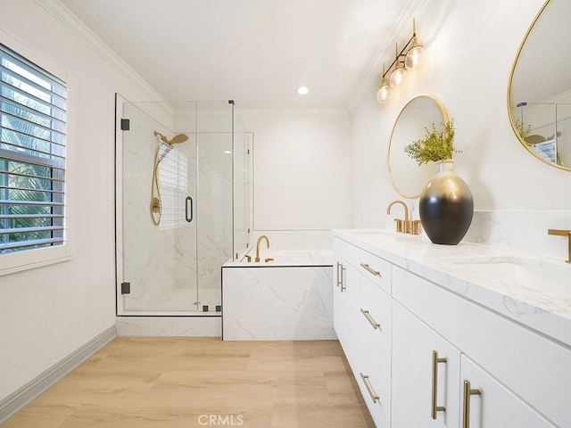 bathroom featuring hardwood / wood-style floors, plenty of natural light, ornamental molding, and plus walk in shower