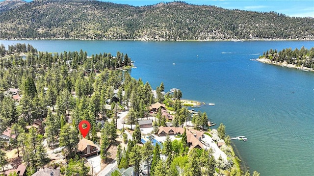 aerial view featuring a water and mountain view