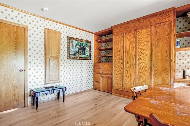 office featuring ornamental molding and light wood-type flooring