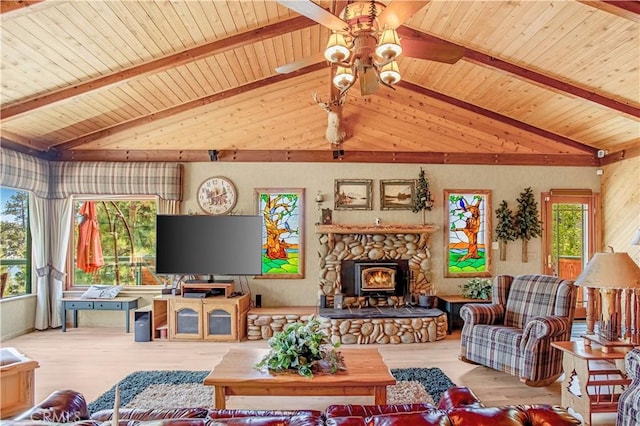 living room with ceiling fan, lofted ceiling with beams, light hardwood / wood-style floors, and wooden ceiling