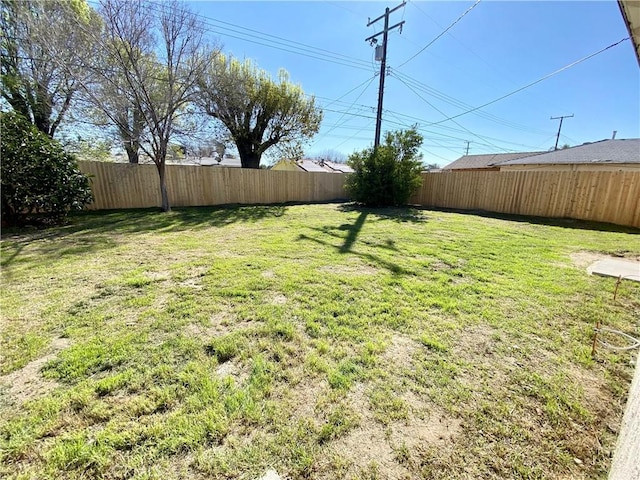 view of yard featuring a fenced backyard