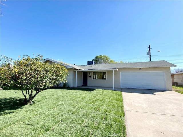 single story home featuring a garage, concrete driveway, a front lawn, and stucco siding