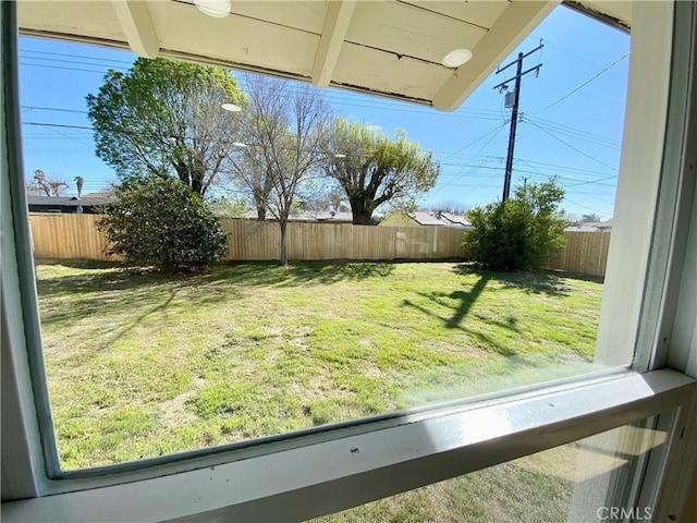 view of yard with a fenced backyard