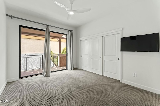 unfurnished bedroom featuring ceiling fan, carpet flooring, a closet, and access to outside