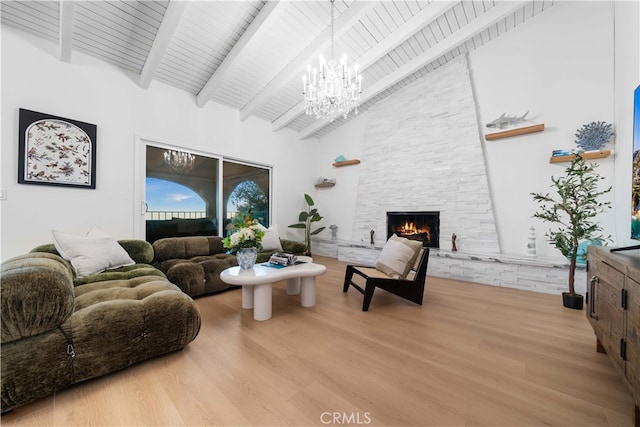 living room featuring wood-type flooring, a stone fireplace, high vaulted ceiling, and wood ceiling