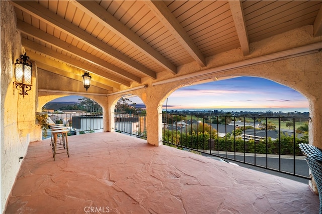 view of patio terrace at dusk