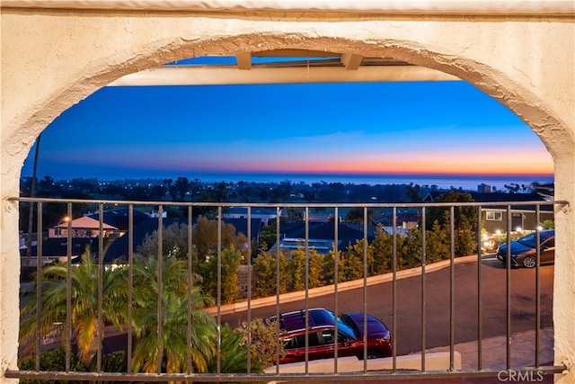 view of balcony at dusk