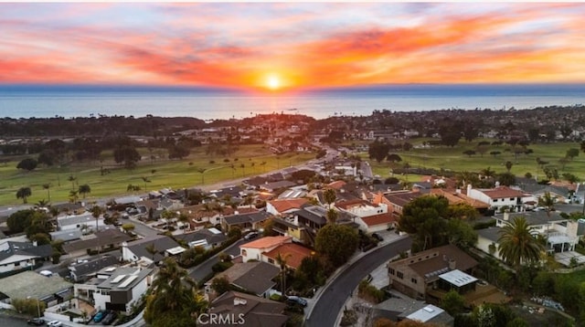 aerial view at dusk with a water view