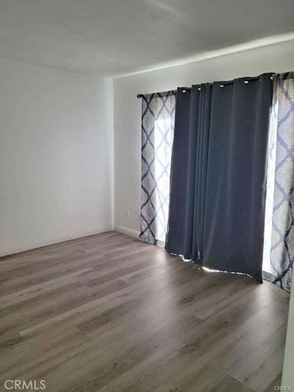 spare room featuring hardwood / wood-style floors