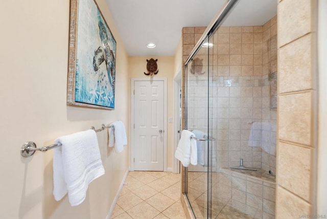 bathroom with tile patterned floors and an enclosed shower