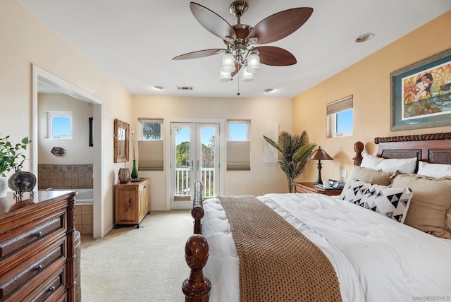 bedroom featuring multiple windows, light colored carpet, access to exterior, and french doors