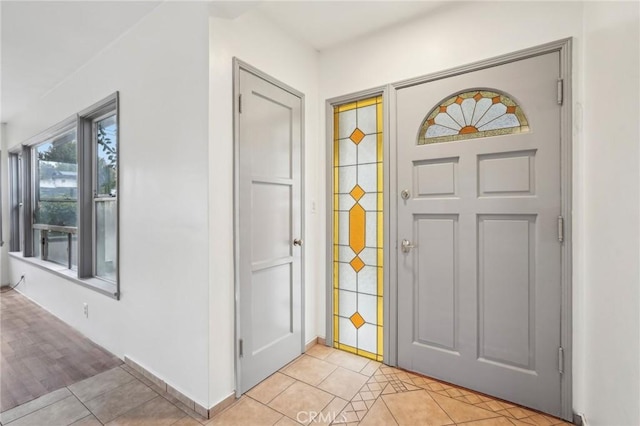 entryway with light tile patterned floors