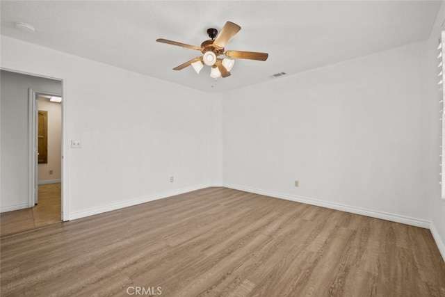 unfurnished room featuring ceiling fan and light wood-type flooring