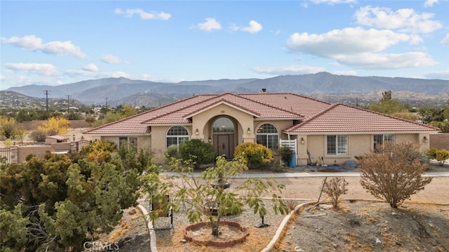 mediterranean / spanish-style home with a mountain view