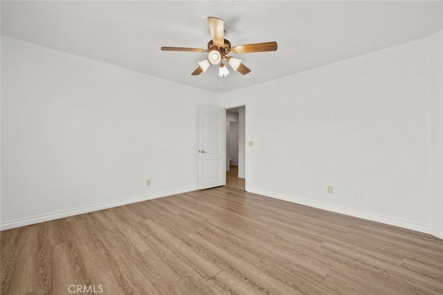 unfurnished room with ceiling fan and light wood-type flooring